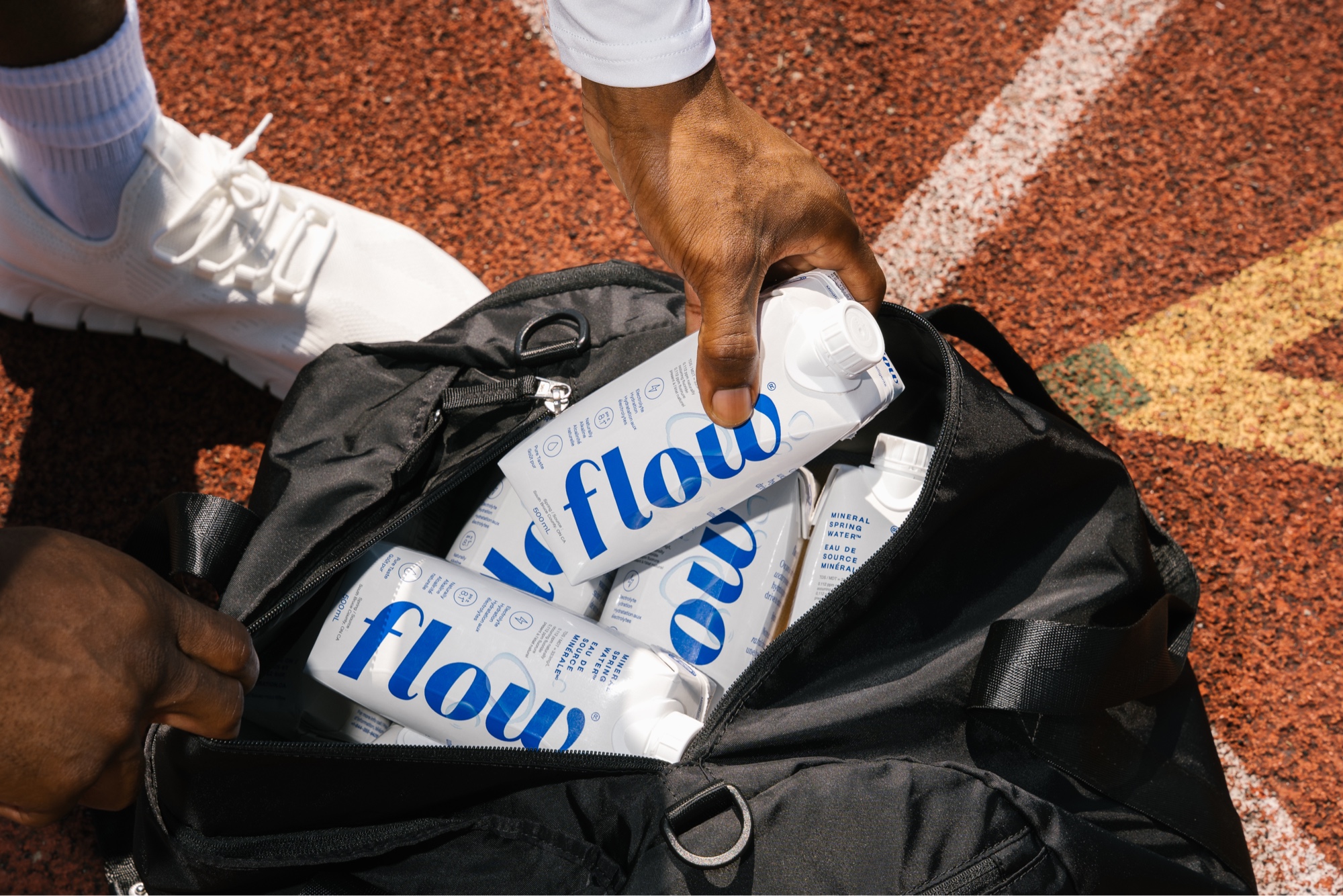 Flow Water cartons in gym bag