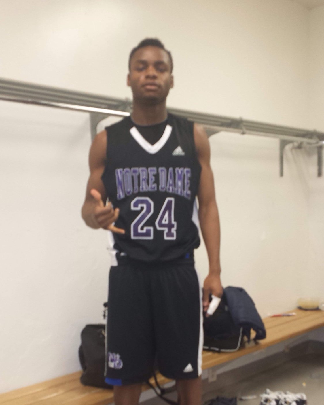 Duan Asemota in his Notre Dame Catholic basketball uniform, number 24, before track