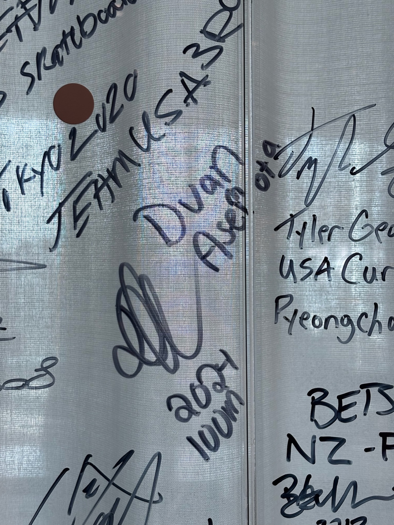 Close up of Duan Asemota signature on the IOC Olympians' wall, marked 2024 100m