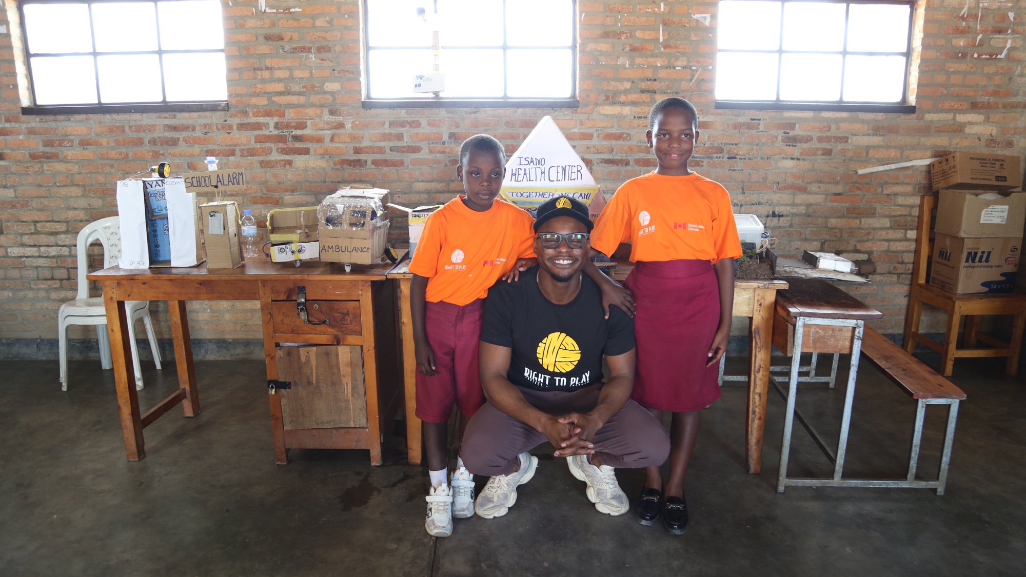 Duan Asemota with students at a Right To Play health center