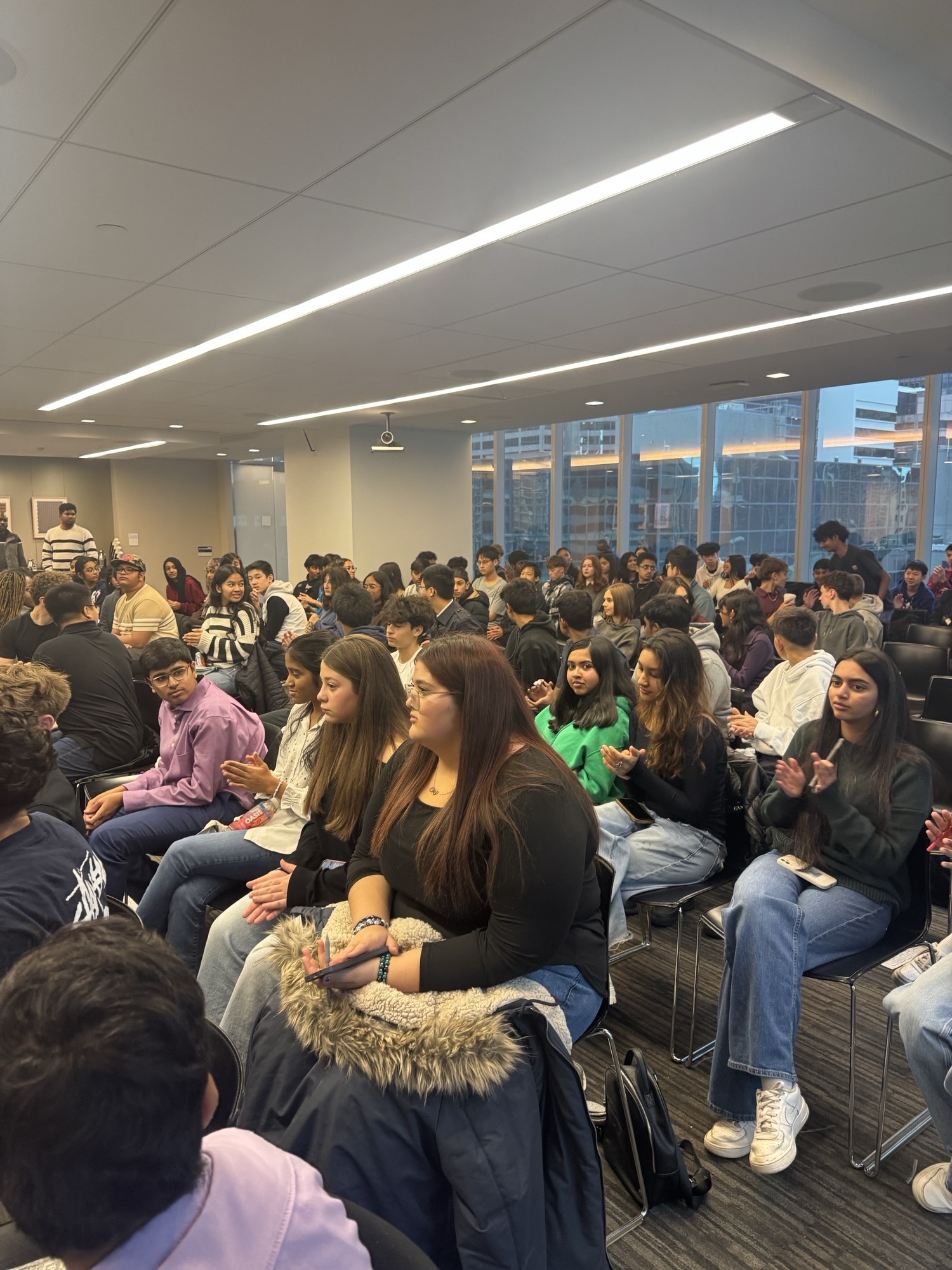 Duan Asemota speaking to a corporate audience of youth and professionals in a downtown Toronto boardroom