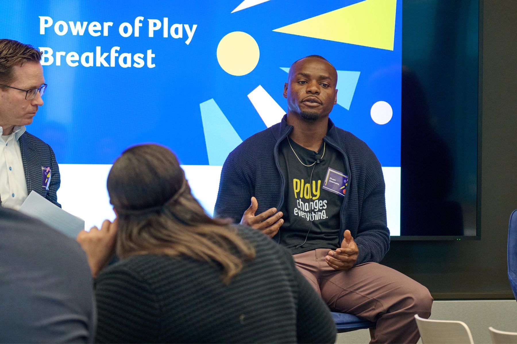 Duan Asemota animated on a speaking panel